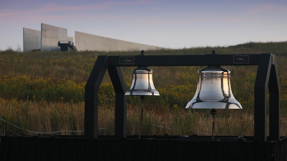 Two large bells known as the Bells of Remembrance sit in the field below the visitor center.