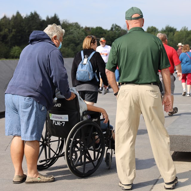 A Flight 93 volunteer speaking to visitors at the Memorial Plaza.