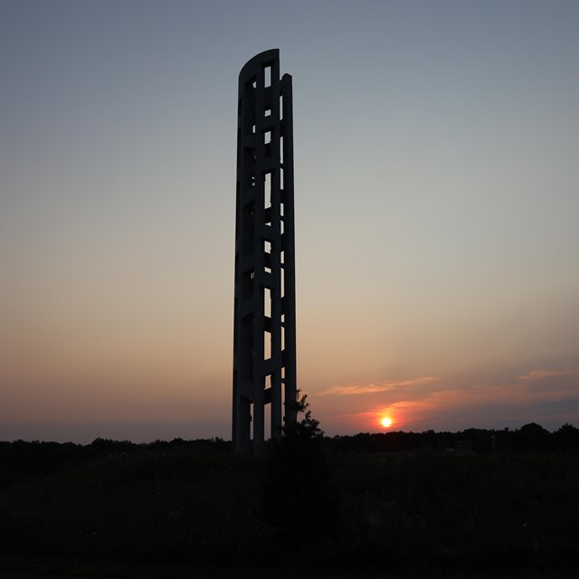The Tower of Voices at the memorial during sunset.