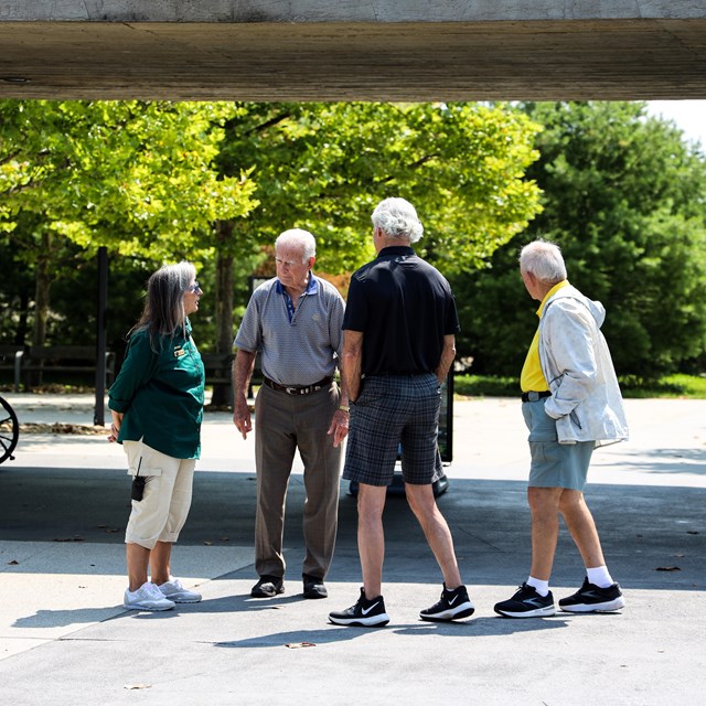 A Flight 93 National Memorial Ambassador speaks with visitors at the memorial plaza