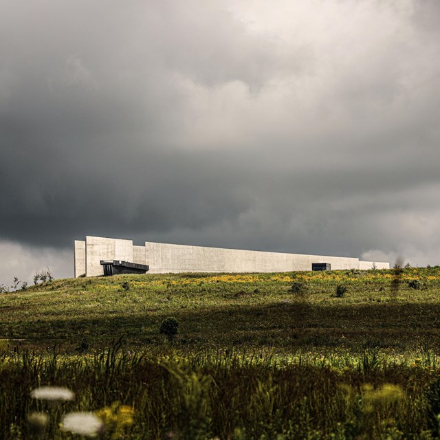 Visitor Center with dark clouds.