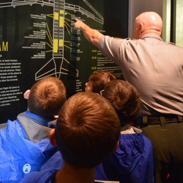 A park ranger and students.