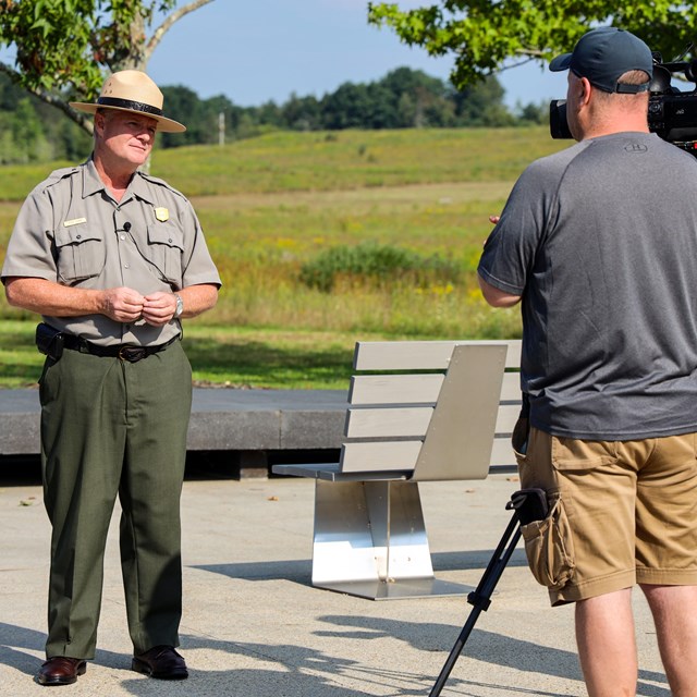 Ranger in front of cameras.