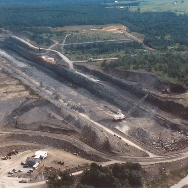 Image of open face coal mining.