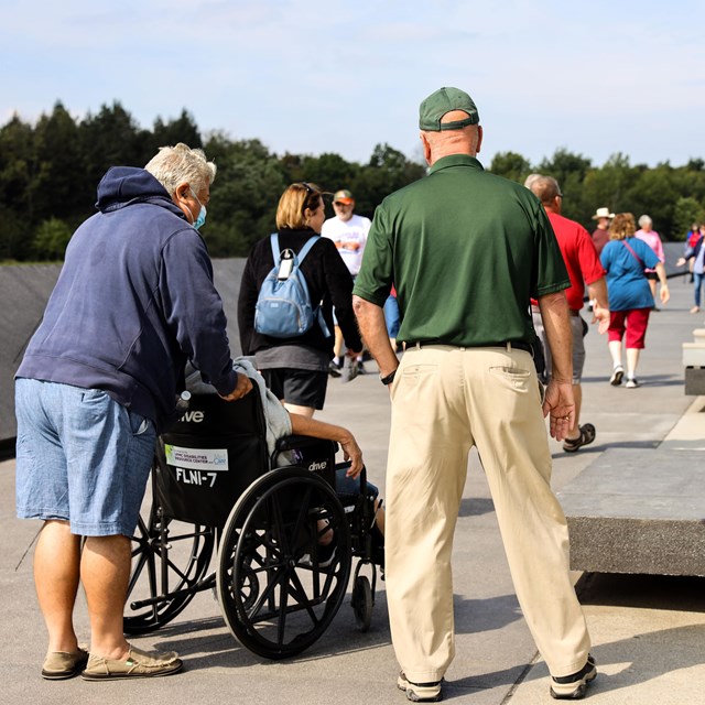 Visitors at the Memorial Plaza walkway greeted by Flight 93 volunteer.
