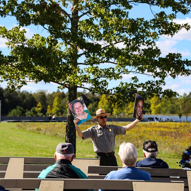 A park ranger shares a program of the Flight 93 story at the Memorial Plaza flagpole.