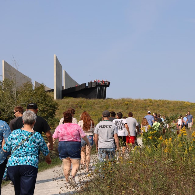 Visitors walking towards the Visitor Center.