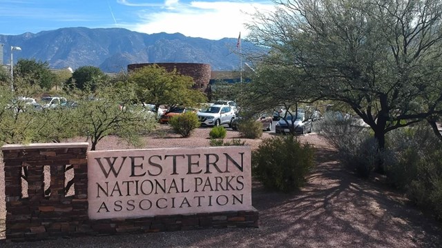 A sign in front of a building