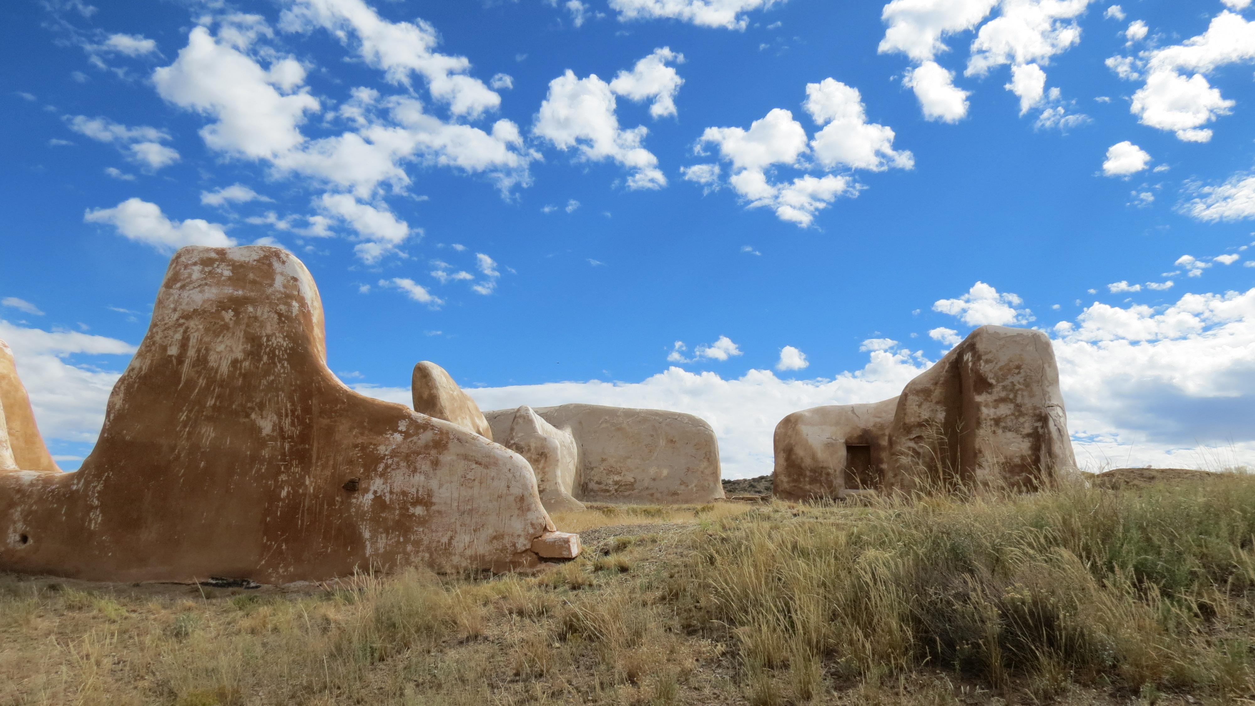 White plastered ruins of a building with a blue sky.
