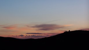 A ridge silhouetted at sunset