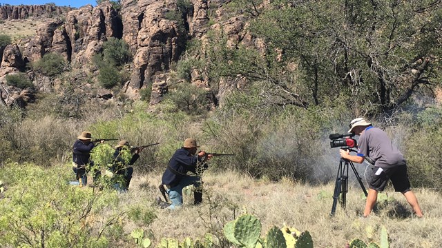 Filming a shooting scene