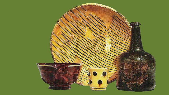 A picture of some ceramics and a wine bottle