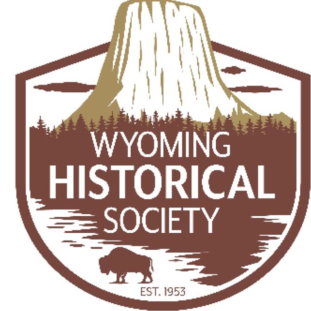 Logo of the Wyoming Historical Society, includes, a Buffalo in front of Devil Tower