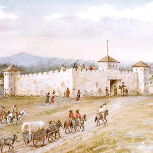 A painting depicting a fort with several people riding horses in the foreground, set against a sce