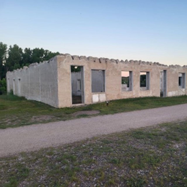 Lime grouted walls with no roof and several window openings. 