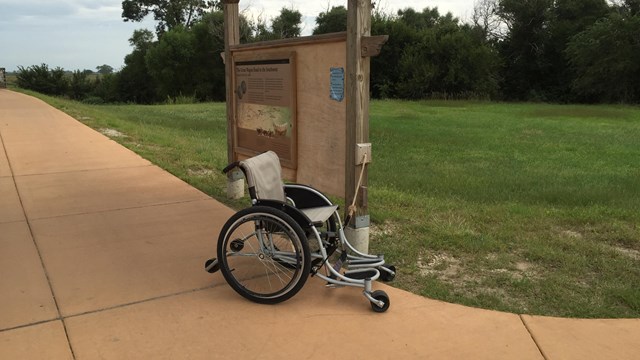Wheelchair by the the walkway.
