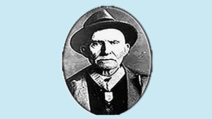 Photo of an older man wearing a Medal of Honor.