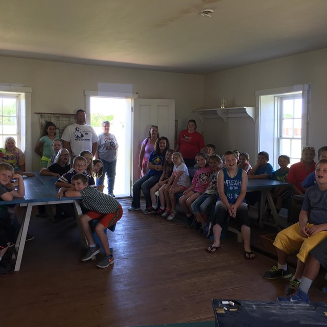 Students in post school house.