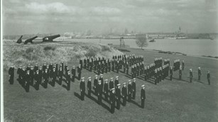 Coast Guard standing in formation at Fort McHenry's outer battery.