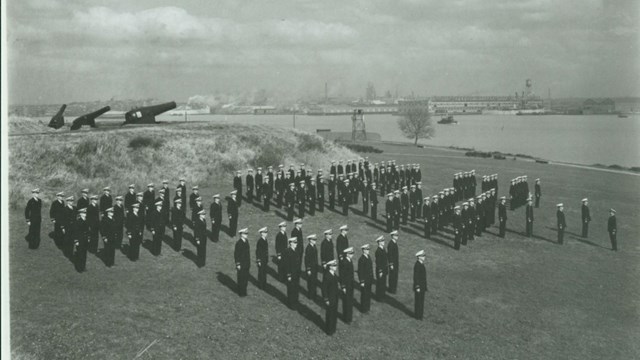 Coast Guard standing in formation at Fort McHenry's outer battery.