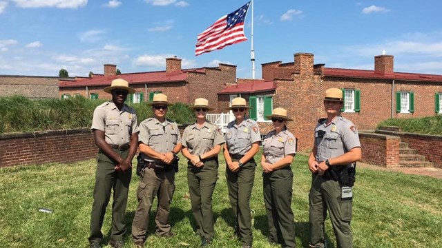 Park Rangers gathered inside fort