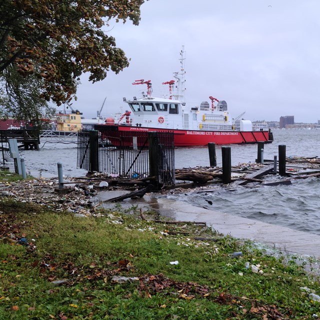 Boat with trash washed ashore