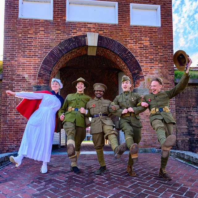 Living historians in Red Cross nurse and Army Medical Corps uniform in Sally Port