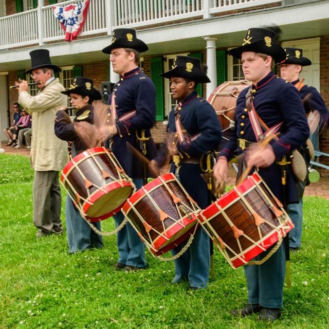 Fifers and drummers performing in Civil War U.S. Army uniform.