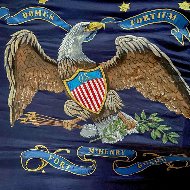 Blue flag with eagle and Fort McHenry Guard logo