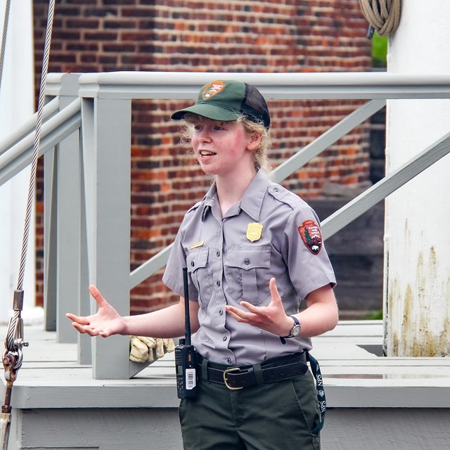 A ranger giving a program inside historic star fort.