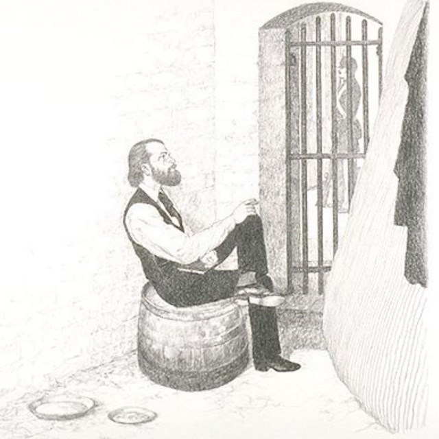 Confederate prisoner of war inside one of the small cells in Fort McHenry's Civil War Prison