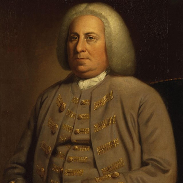 A portrait of a man in a brown suit from the 1700s