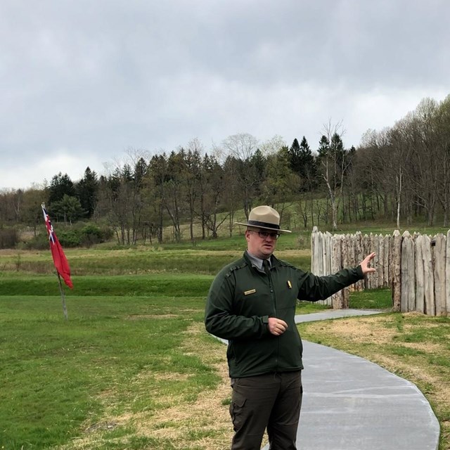 Park Ranger standing in front of Fort Necessiy