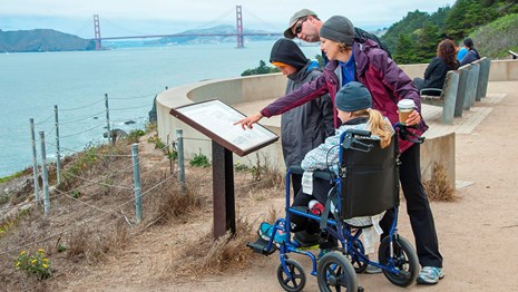 Park visitor using wheelchair accessible trail at Land's End