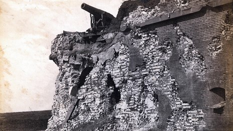 Black and white image of the battered brick walls of Fort Pulaski.