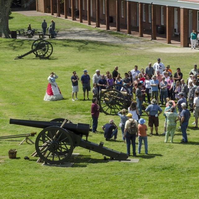 view from above of people watching cannon firing demonstration