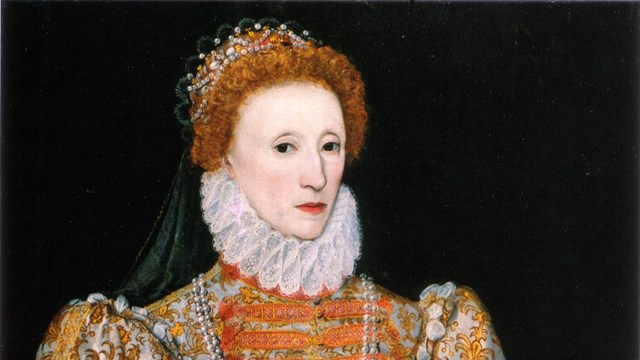 A historical portrait of Queen Elizabeth I in orange decorative clothing and a neck frill