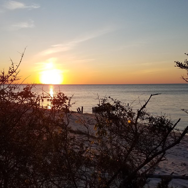 A sunset over a body of water
