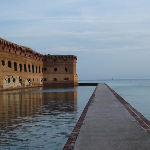 fort on left, moat in center, ocean on right