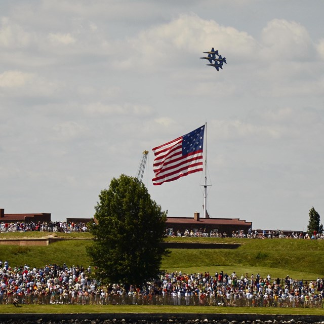 fighter jets fly over fort