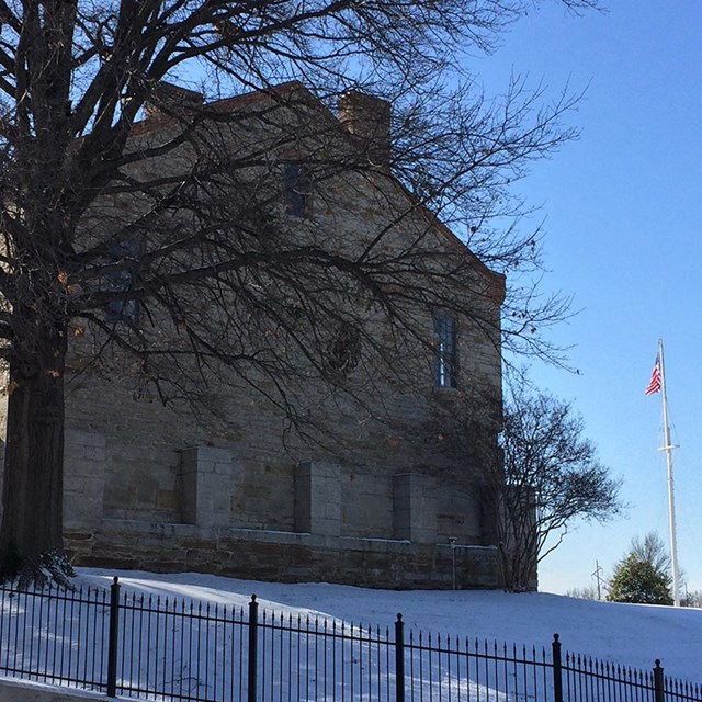 old stone building on hill