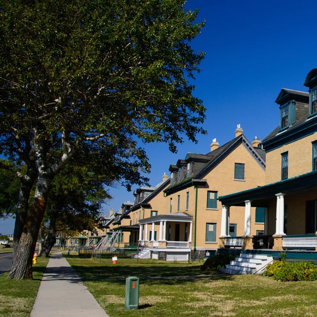 yellow military housing along a street