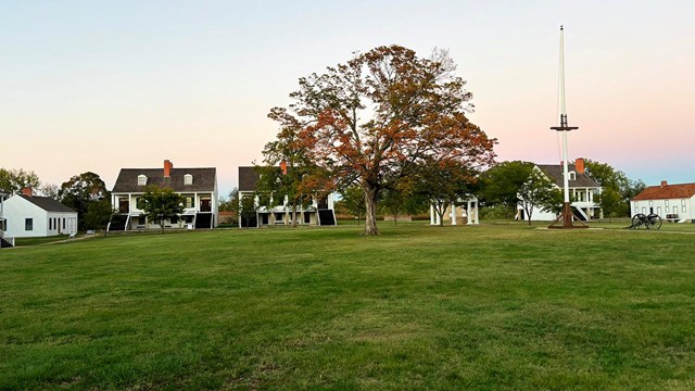 White buildings across the parade ground.