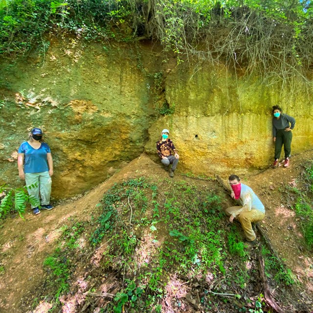 group of people at a fossil site