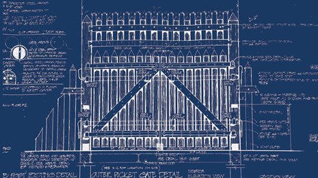 A negative image of a scaled drawing of the large, wooden front gate of the reconstructed fort.