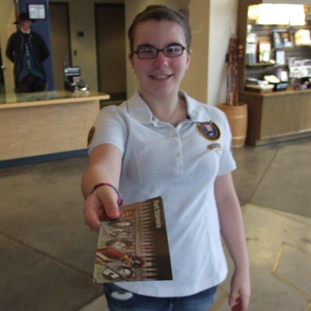 A park volunteer hands you a brochure.