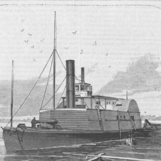 The Planter, a small boat with a cannon at front and space for a paddlewheel at back.