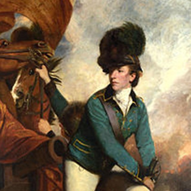 Portrait of Banastre Tarleton standing in military uniform with horses behind him