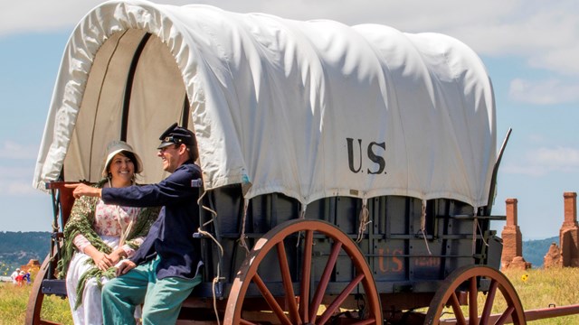 Living History Personnel around historic wagon 