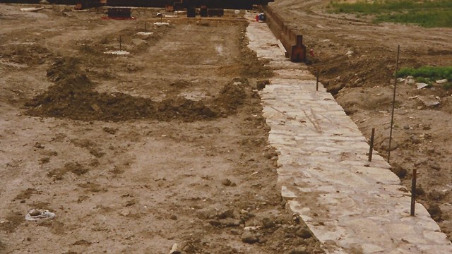 Looking west, the reconstructed foundations for the north palisade wall. 